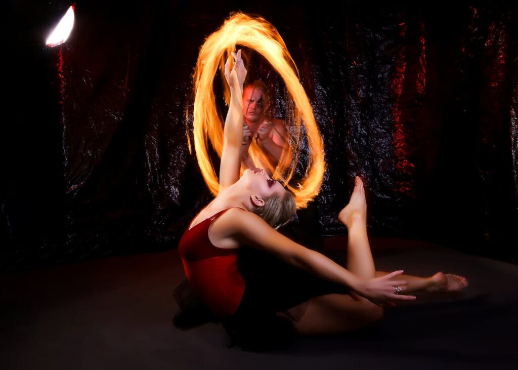 Captivating ballet dance with dramatic fire effects showcasing flexibility and grace.