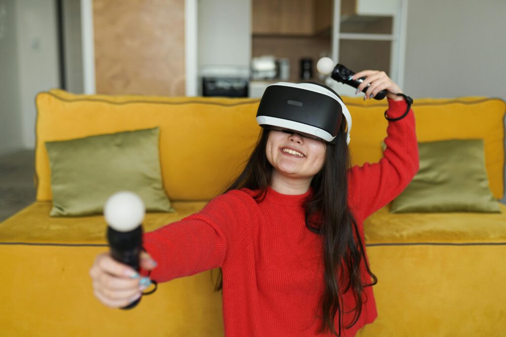 pexels photo 7870822 7870822 Excited woman playing virtual reality games with controllers at home.