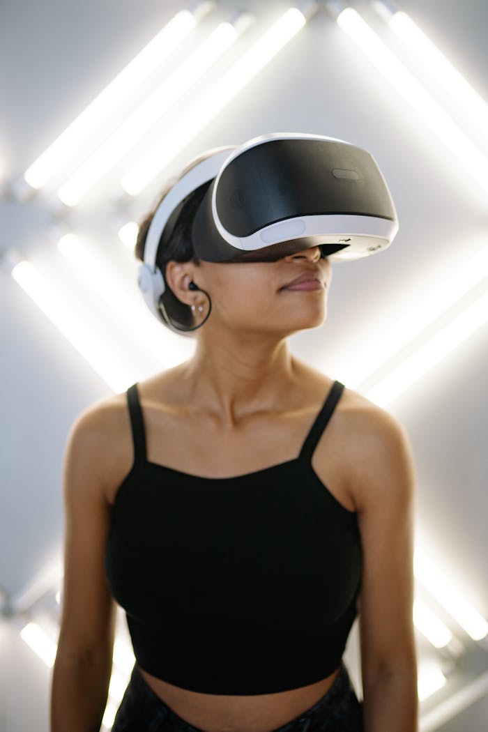 A woman wearing a VR headset immersed in a virtual experience, against a modern background.