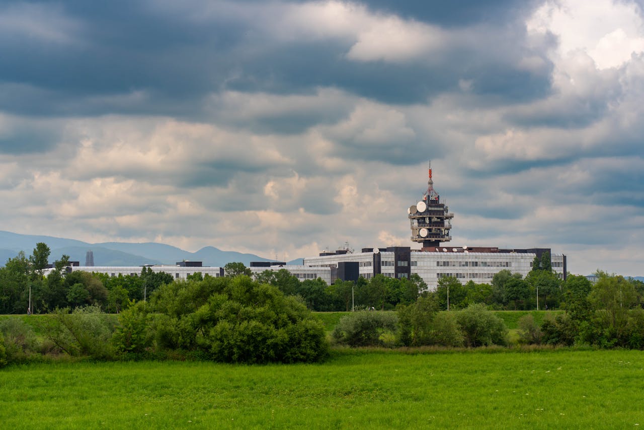 Scenic view of Zagreb's public media headquarters under a cloudy sky.